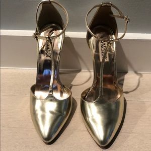 Badgley Mischka gold metallic T strap pumps.